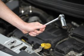 Mechanic Working On Car